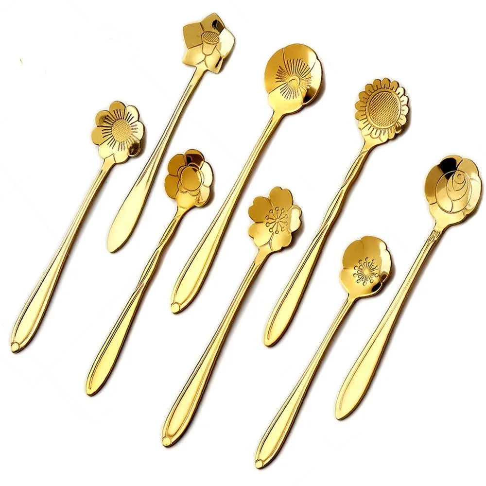 Eight gold stainless steel coffee spoons with floral handles
