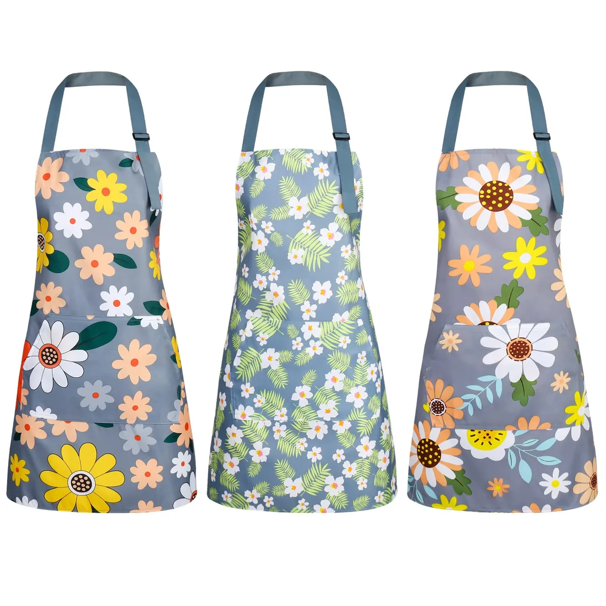 Three floral aprons in PVC and cotton, adjustable straps, front pockets, waterproof finish
