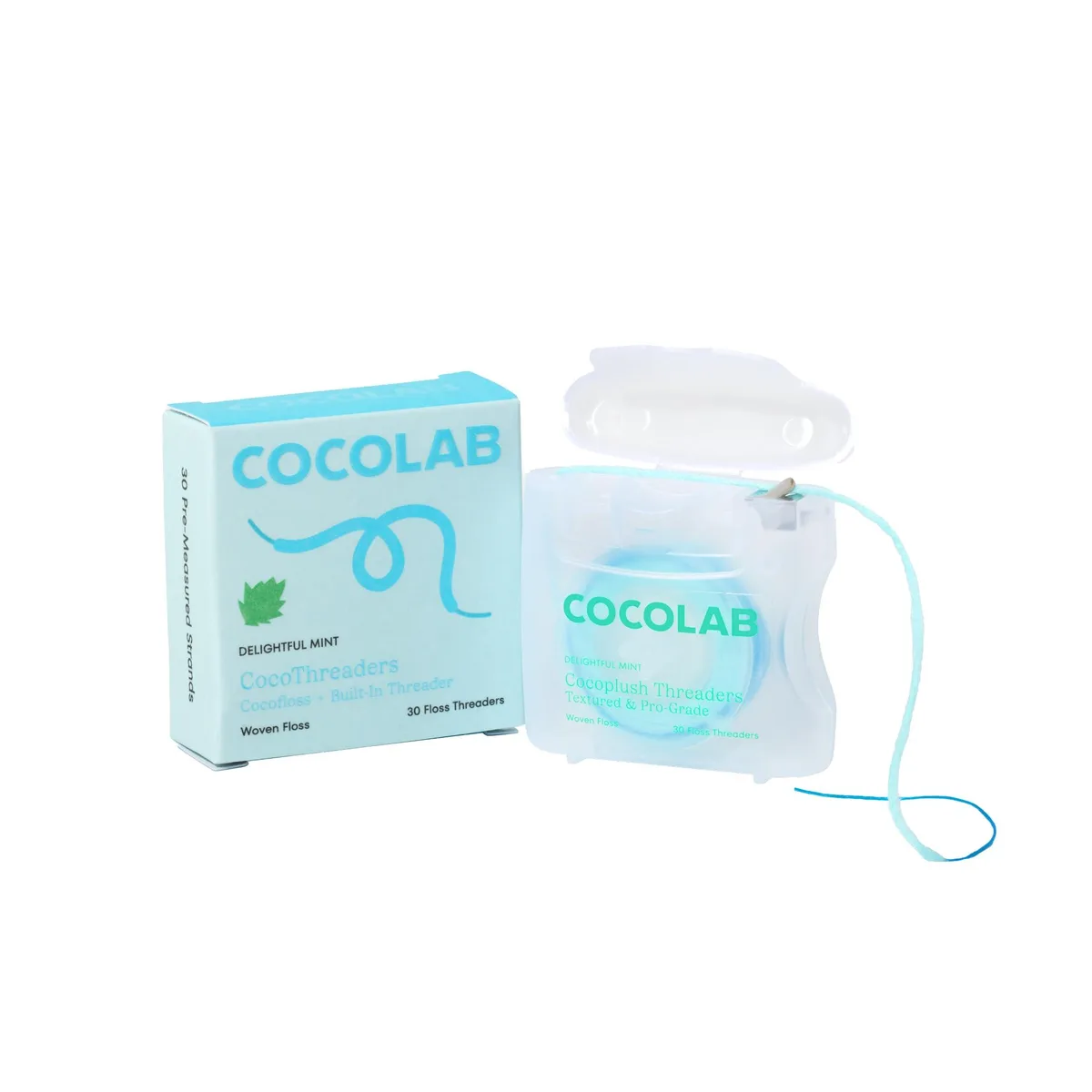 White plastic floss dispenser with mint green accents, rectangular shape, compact handheld size