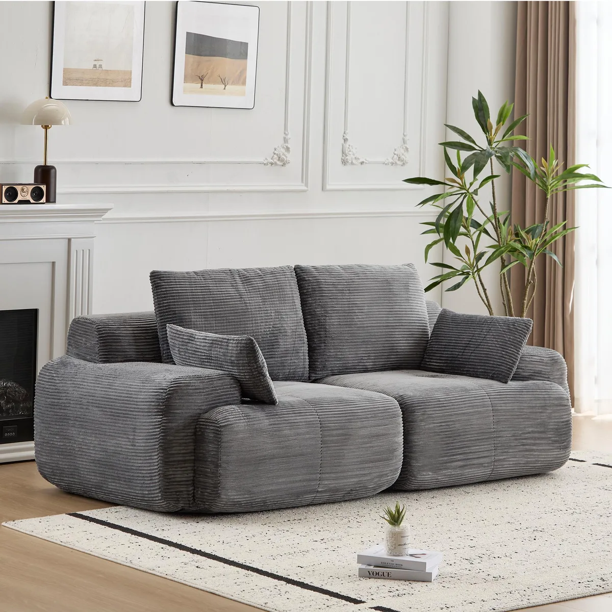 Grey corduroy two-seat sectional sofa with deep cushions and bolsters