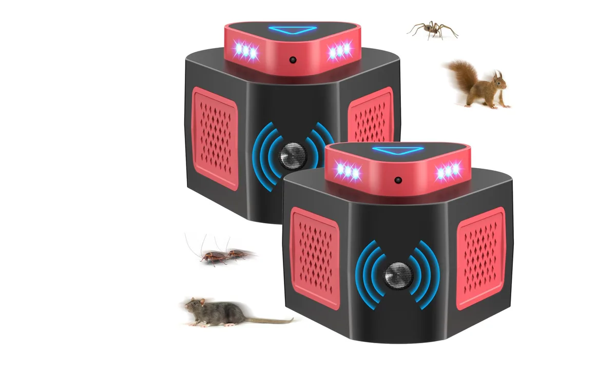 Two small white ultrasonic pest repeller units with plug prongs