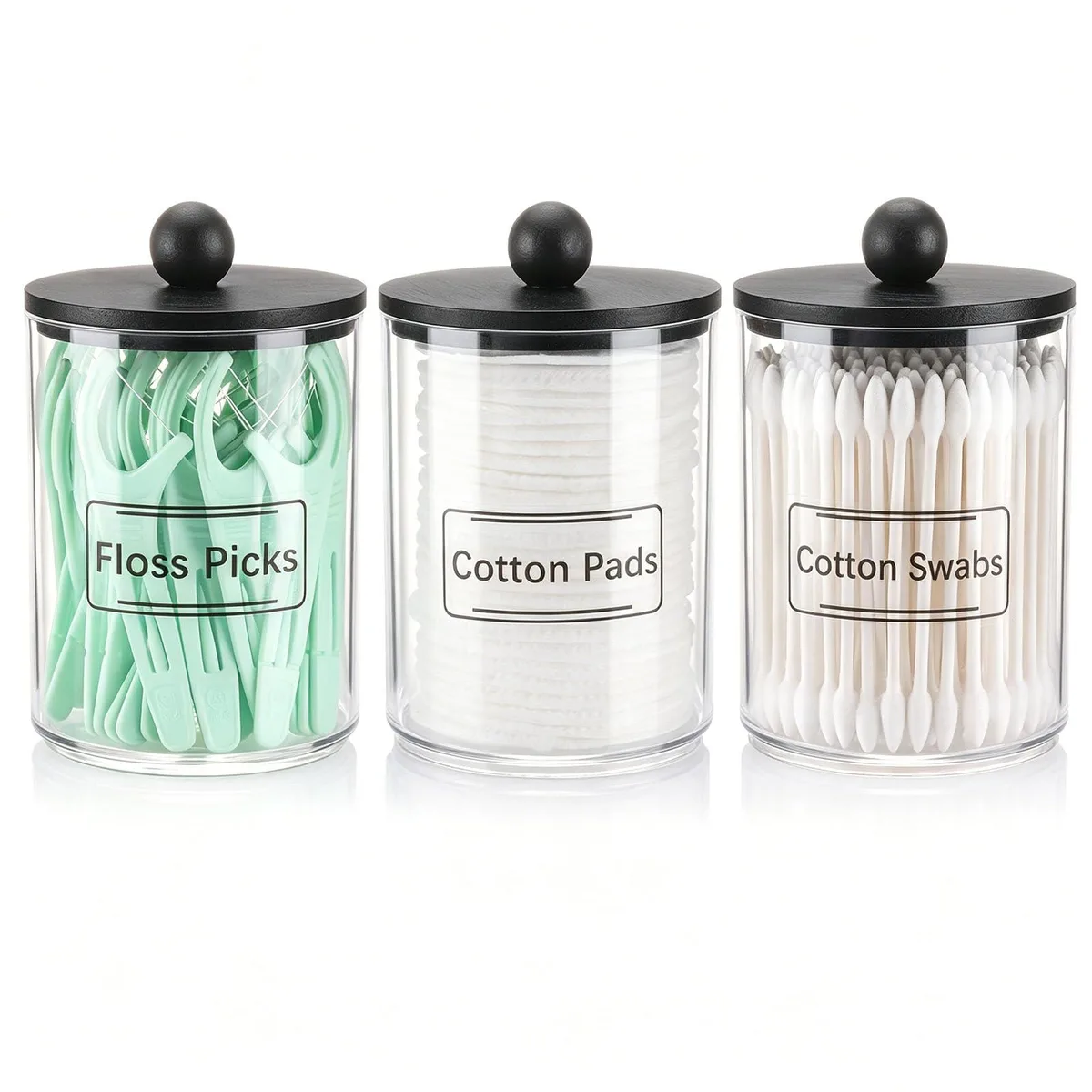 Three clear plastic jars with black wood lids