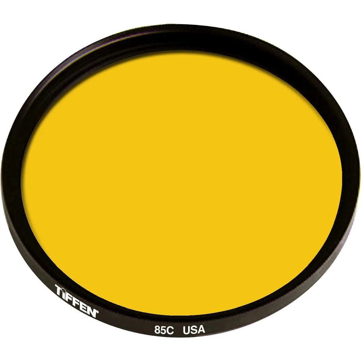 A clear 77mm glass filter with a subtle warm tint in a thin metal ring