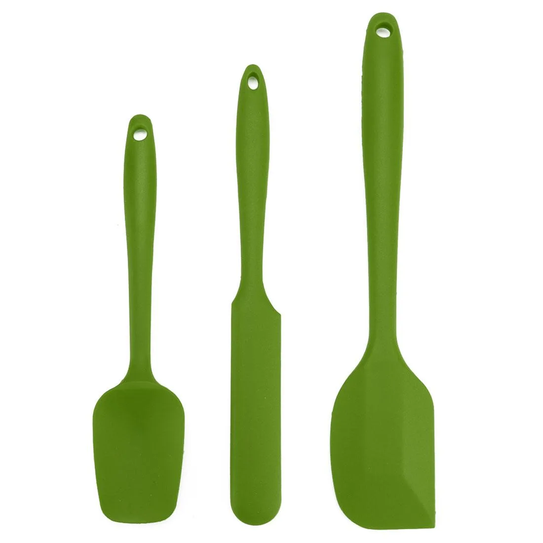 Three green silicone spatulas on a surface: wide turner, long spatula, narrow jar scraper