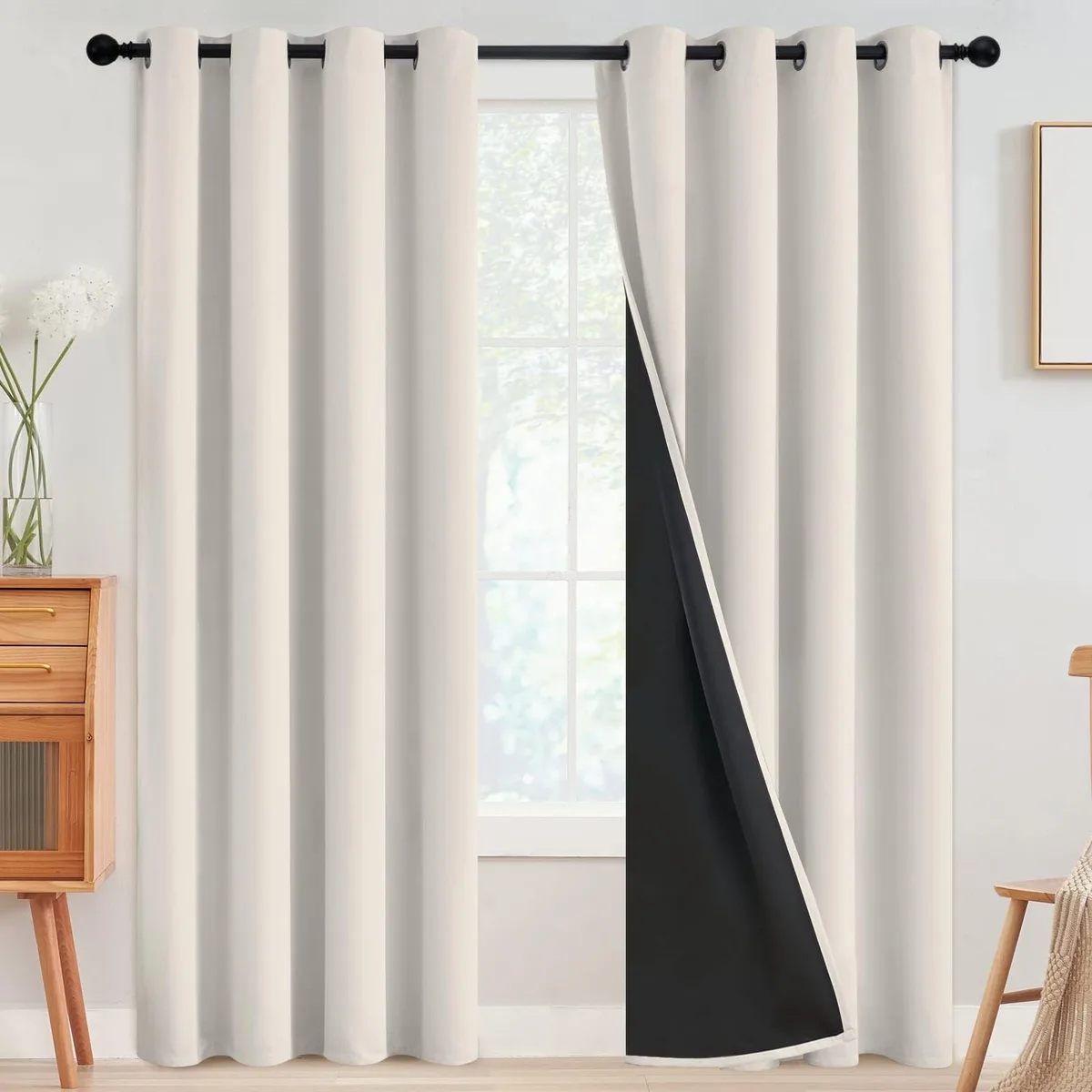 Two cream polyester curtain panels with silver grommets, 52 by 84 inches