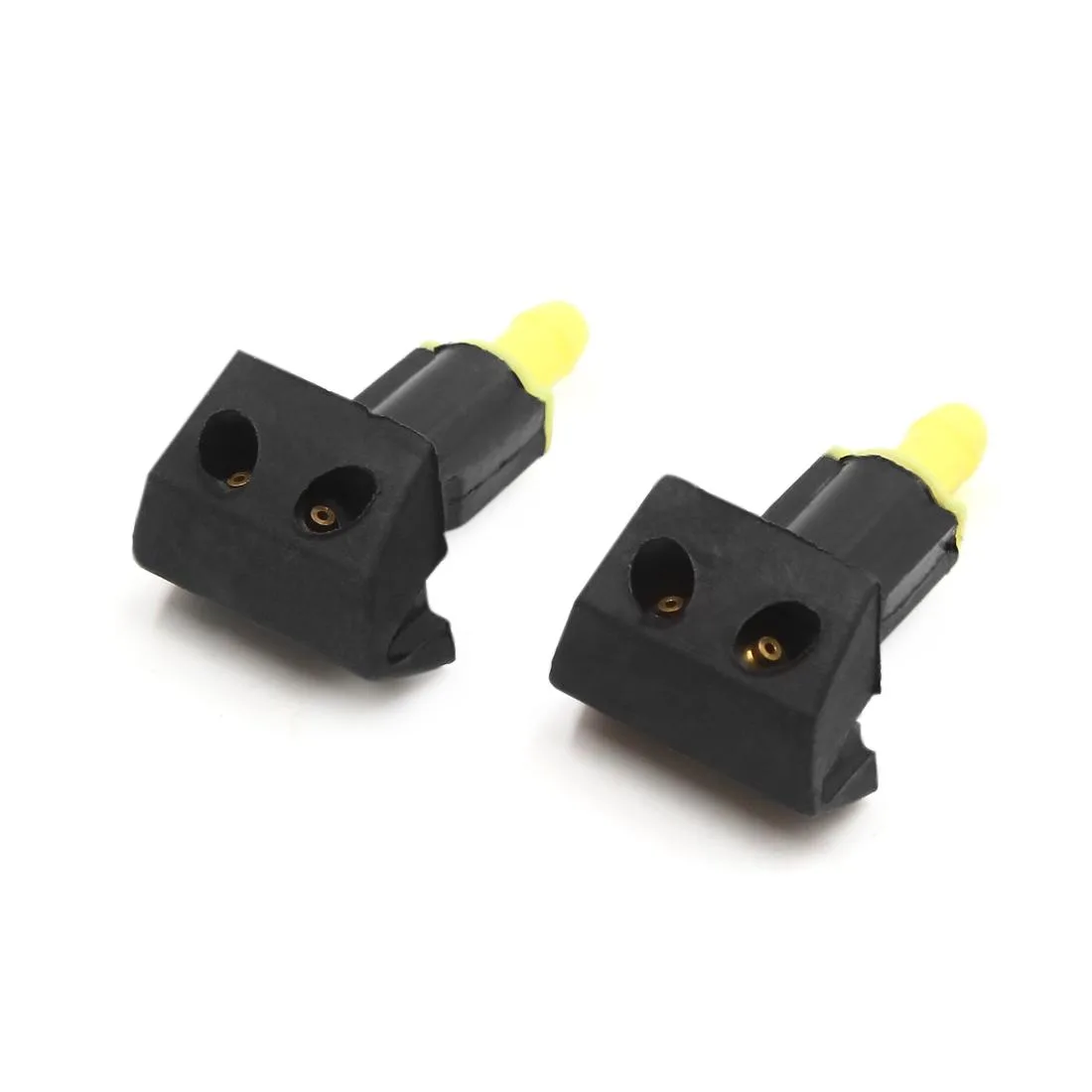Two small black plastic windshield washer nozzles side by side