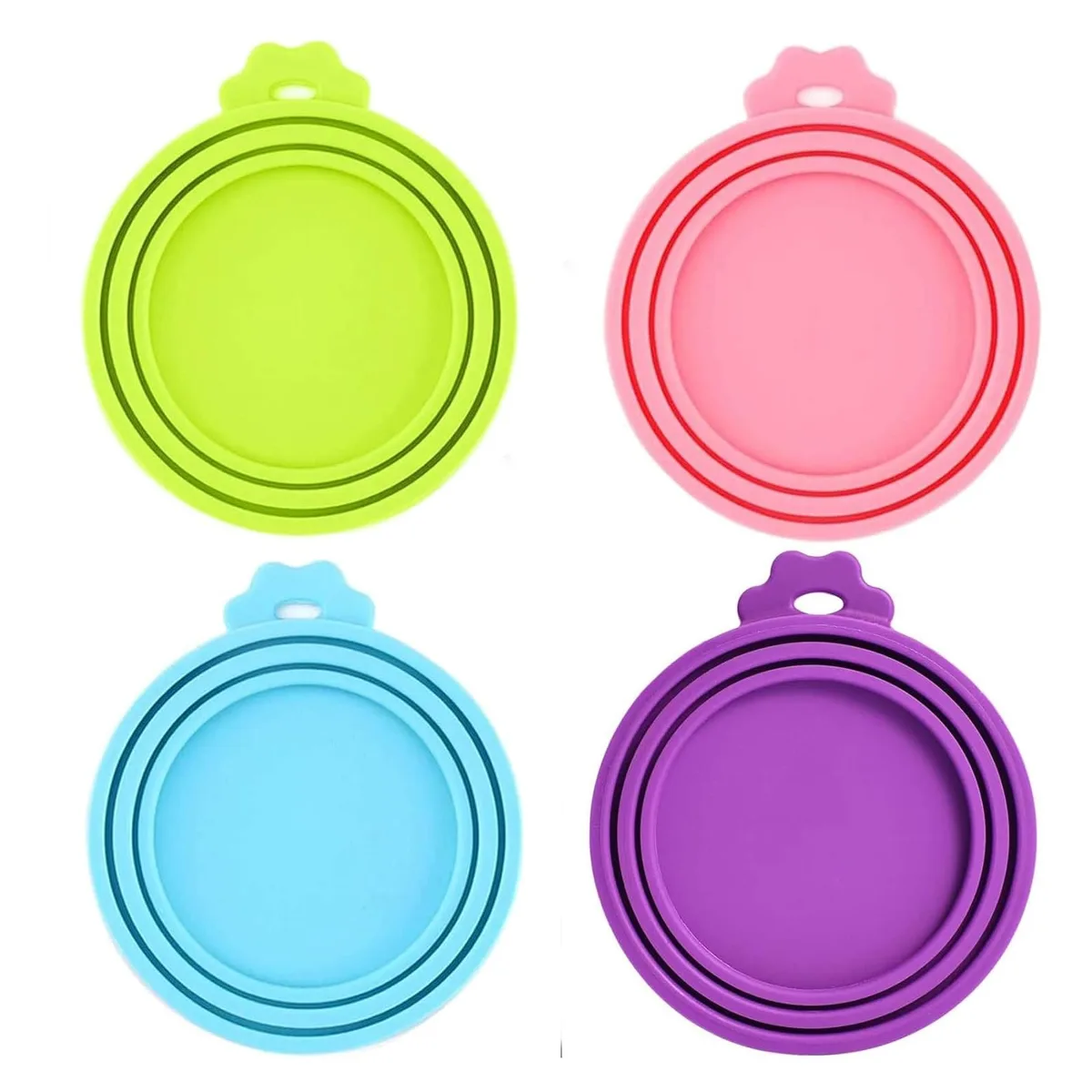 Four green silicone can lids with concentric rings for three can diameters