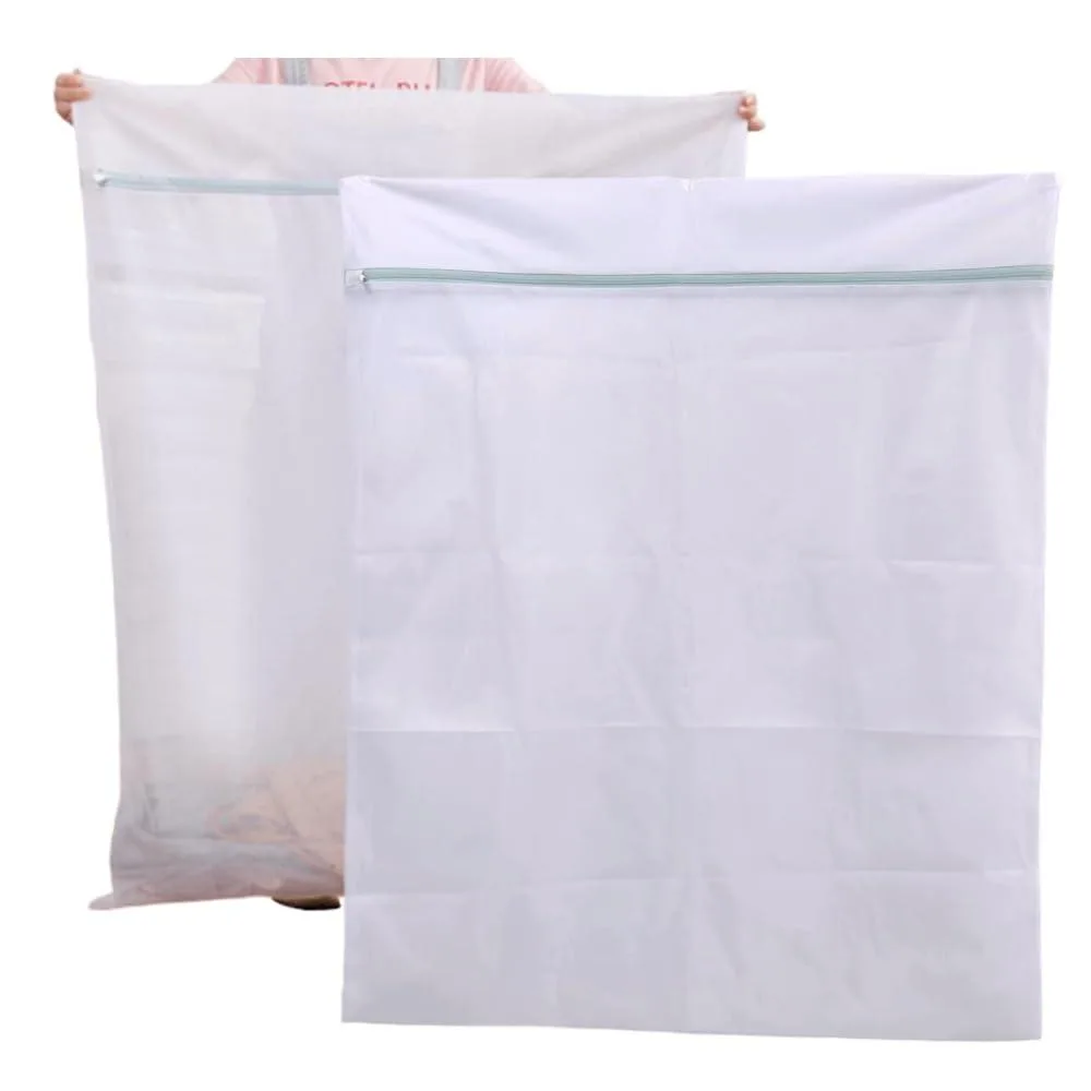 Two beige mesh laundry bags with handles and zip closures, 35 by 43 inches