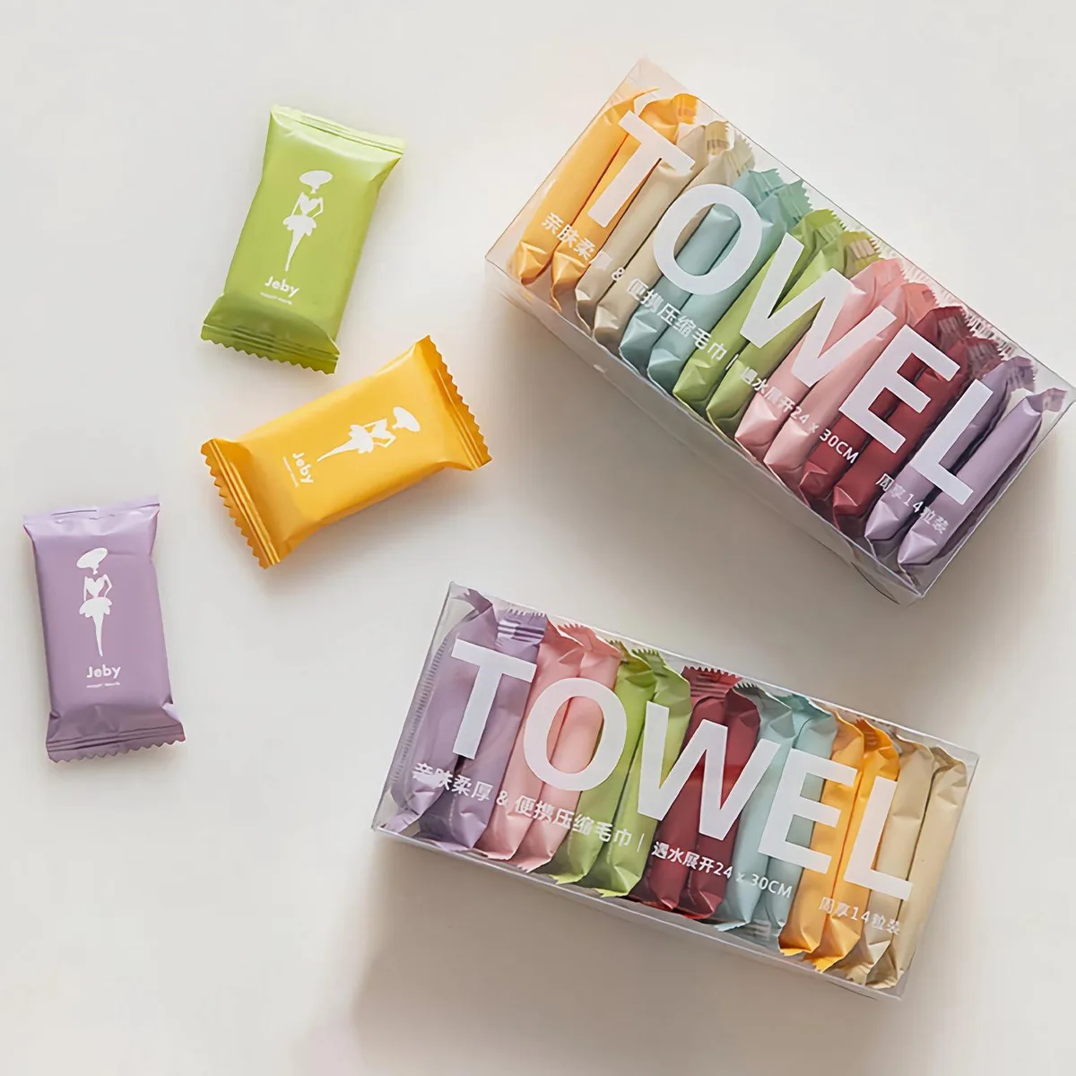 A box of 28 compressed cotton towels in individual wrappers