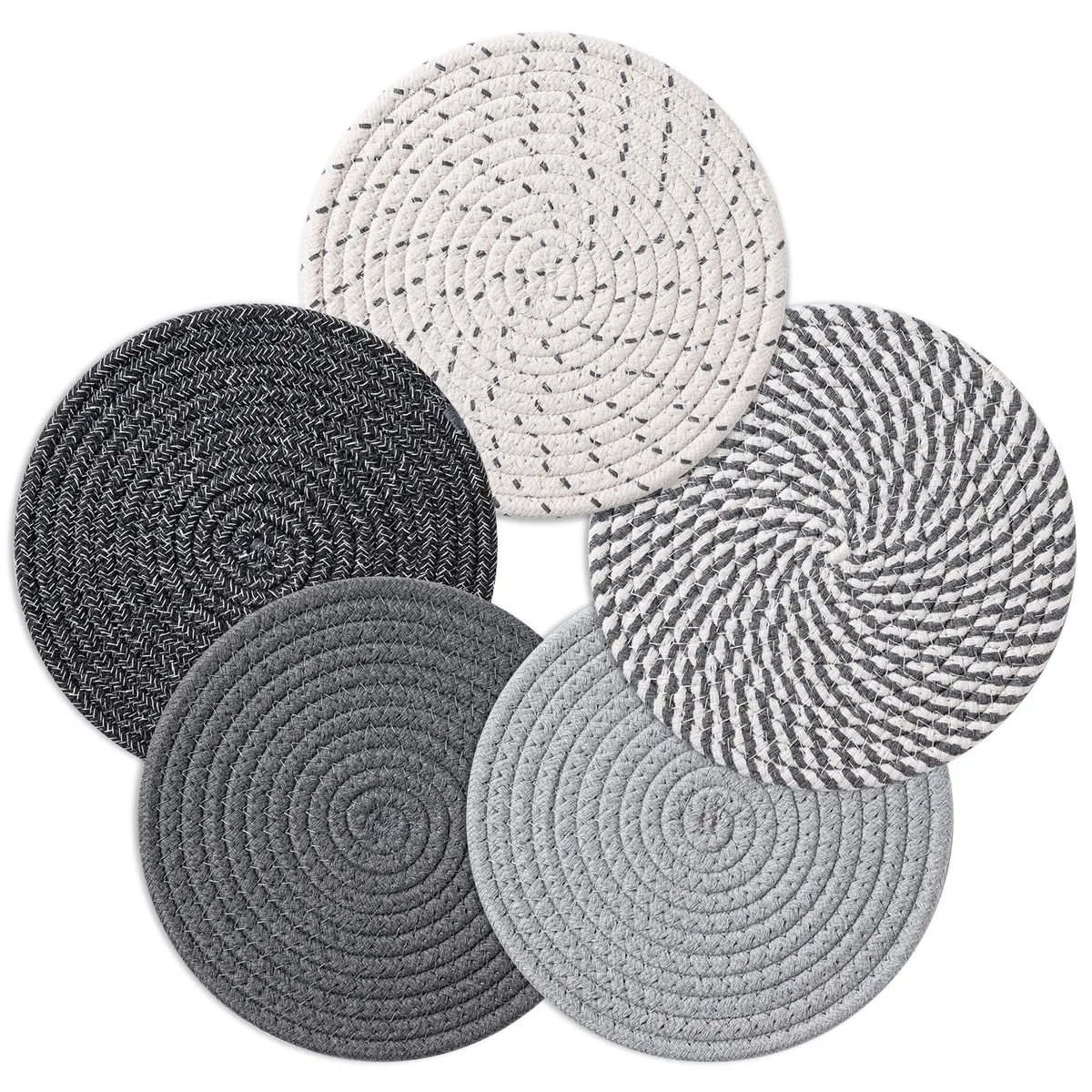 Five round woven cotton trivets in assorted colours, each 7 inches wide and .3 inches thick
