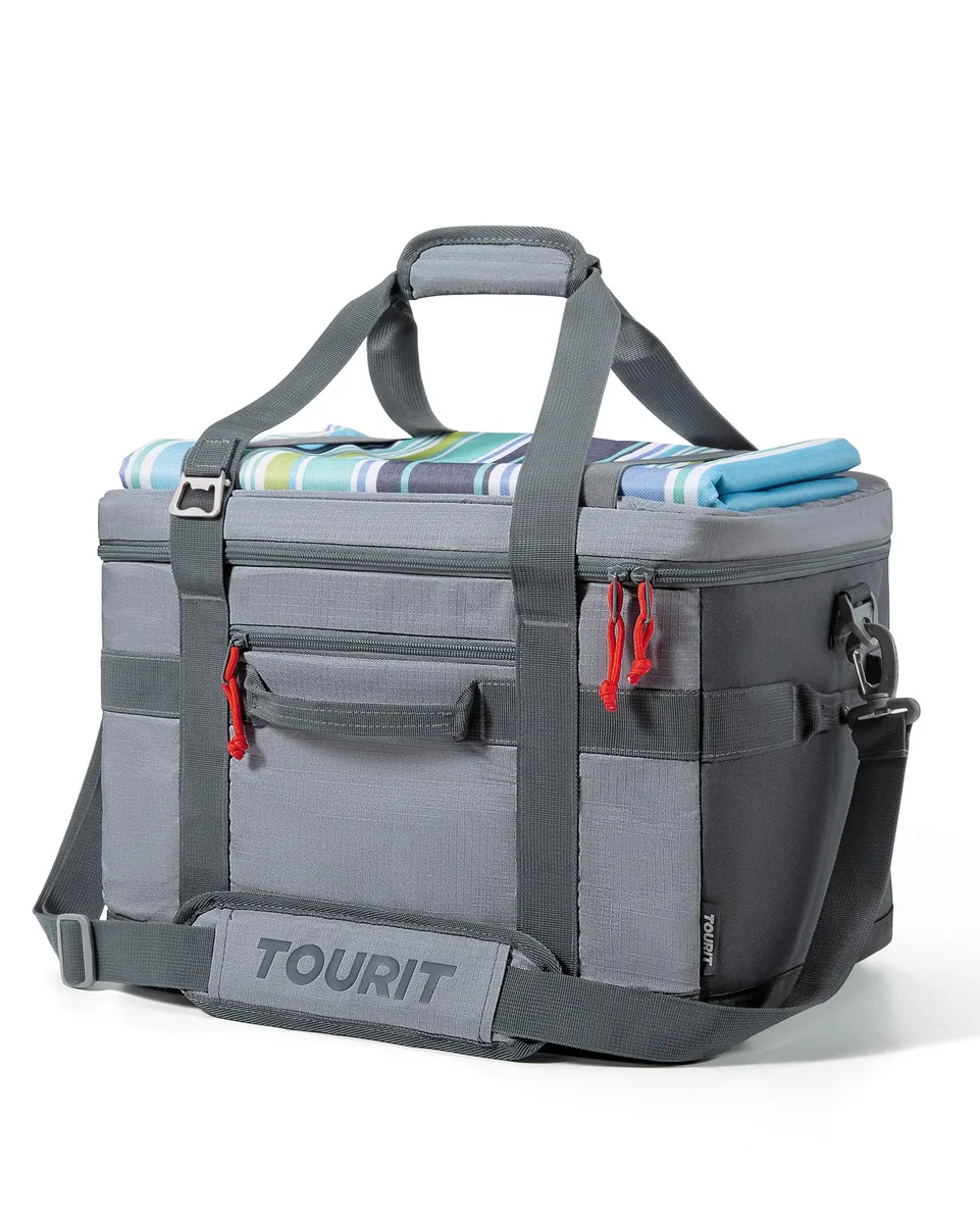 Red soft-sided cooler bag with padded handle and detachable shoulder strap