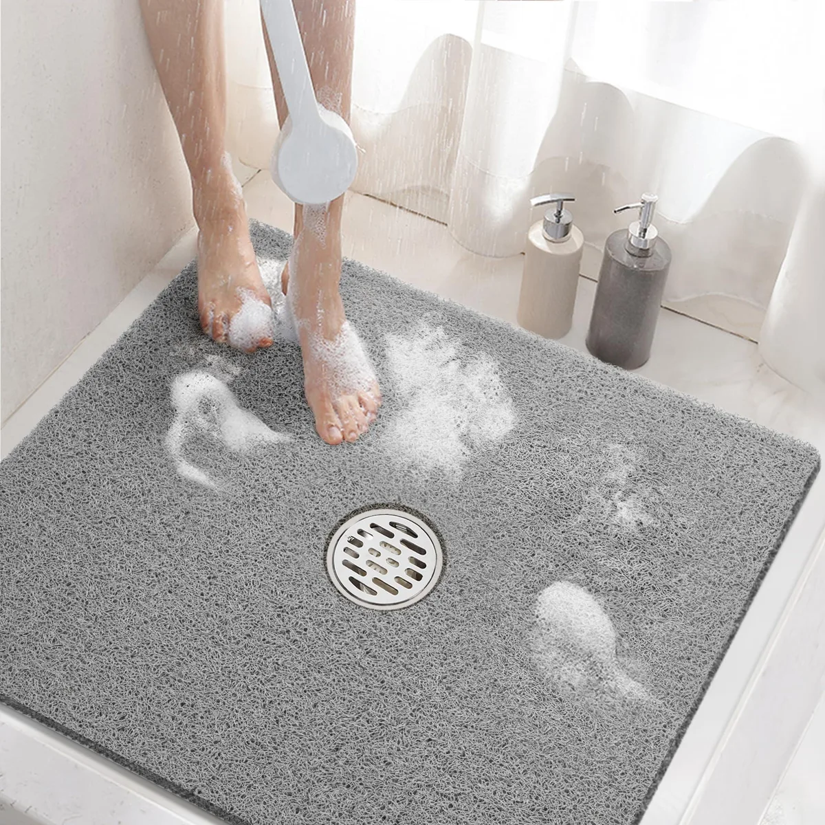 Grey square shower mat 24 x 24 inch soft PVC loofah surface central drain hole lattice backing no suction cups