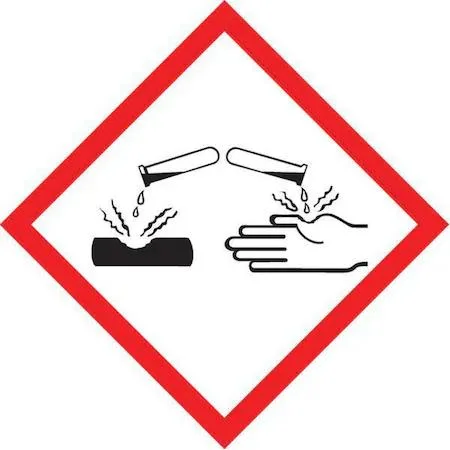 White polyester roll of 250 black GHS corrosive pictogram labels 1 by 1 inch