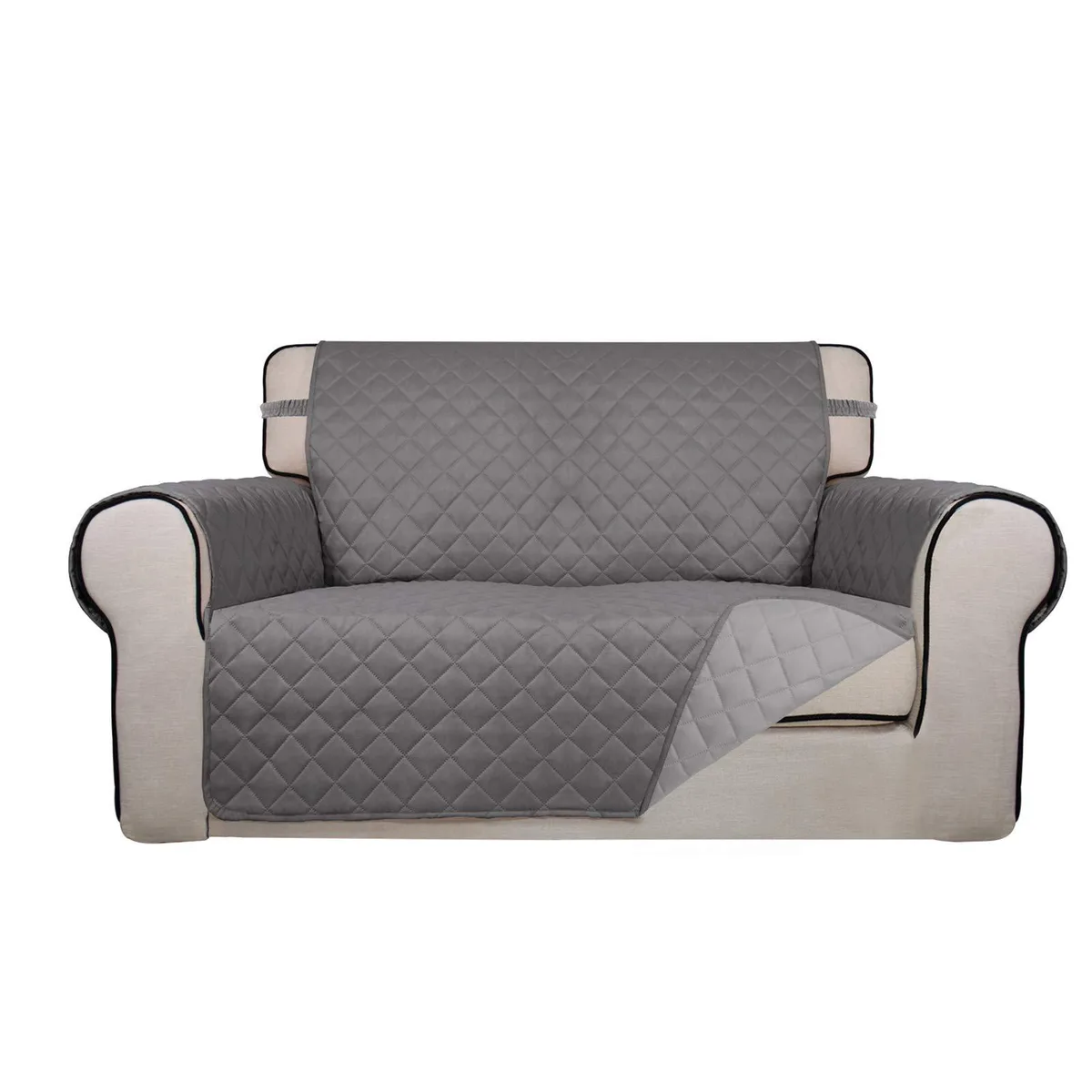 Light gray reversible quilted loveseat cover with elastic straps and foam anchors