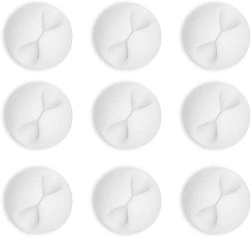 Twelve white adhesive cable clips arranged on a backing sheet