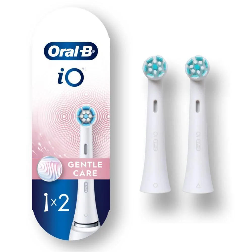 Two white oval brush heads with soft nylon bristles in clear packaging