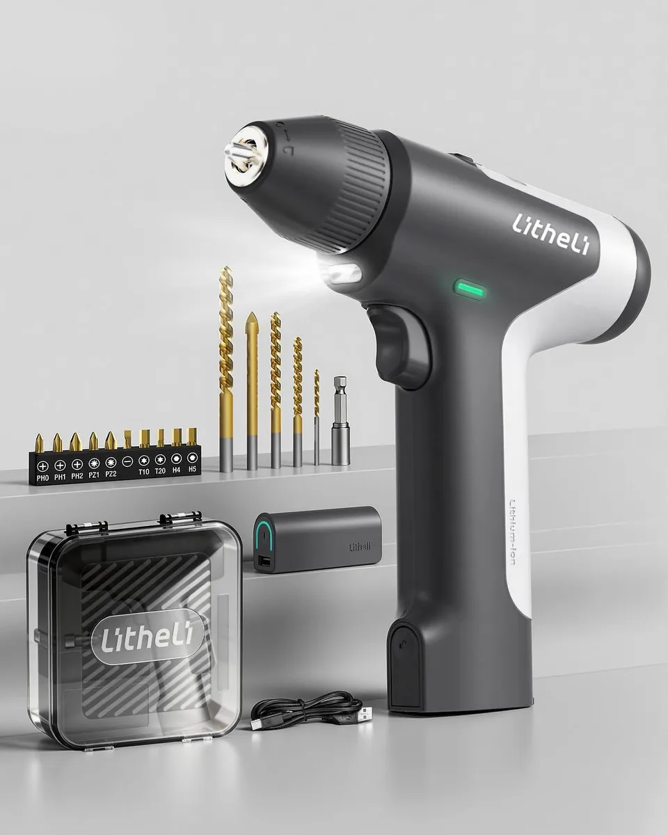 Compact black and white cordless drill driver with 10 mm keyless chuck and removable battery pack