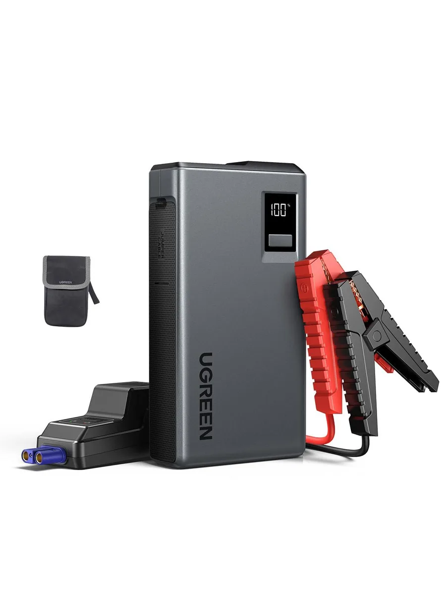 Compact rectangular jump starter with digital screen and LED light, dark grey finish, clamps attached