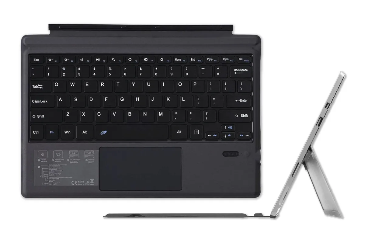 Black Keychron keyboard cover with integrated trackpad for Surface Pro tablets