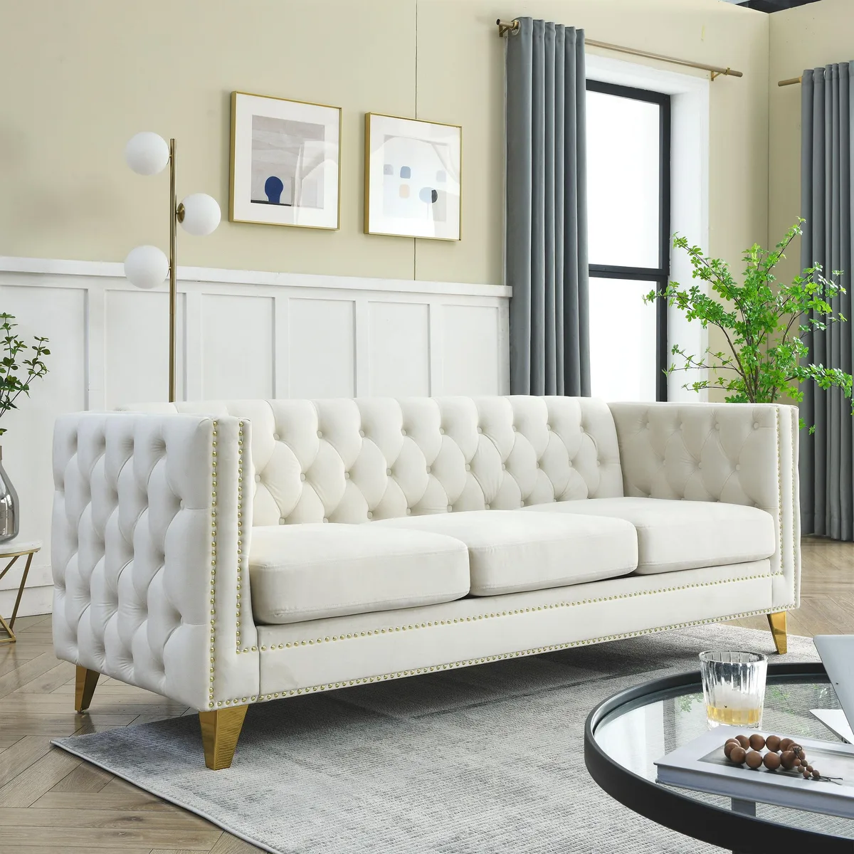 Beige velvet Chesterfield sofa with button tufting square arms nailhead trim metal legs