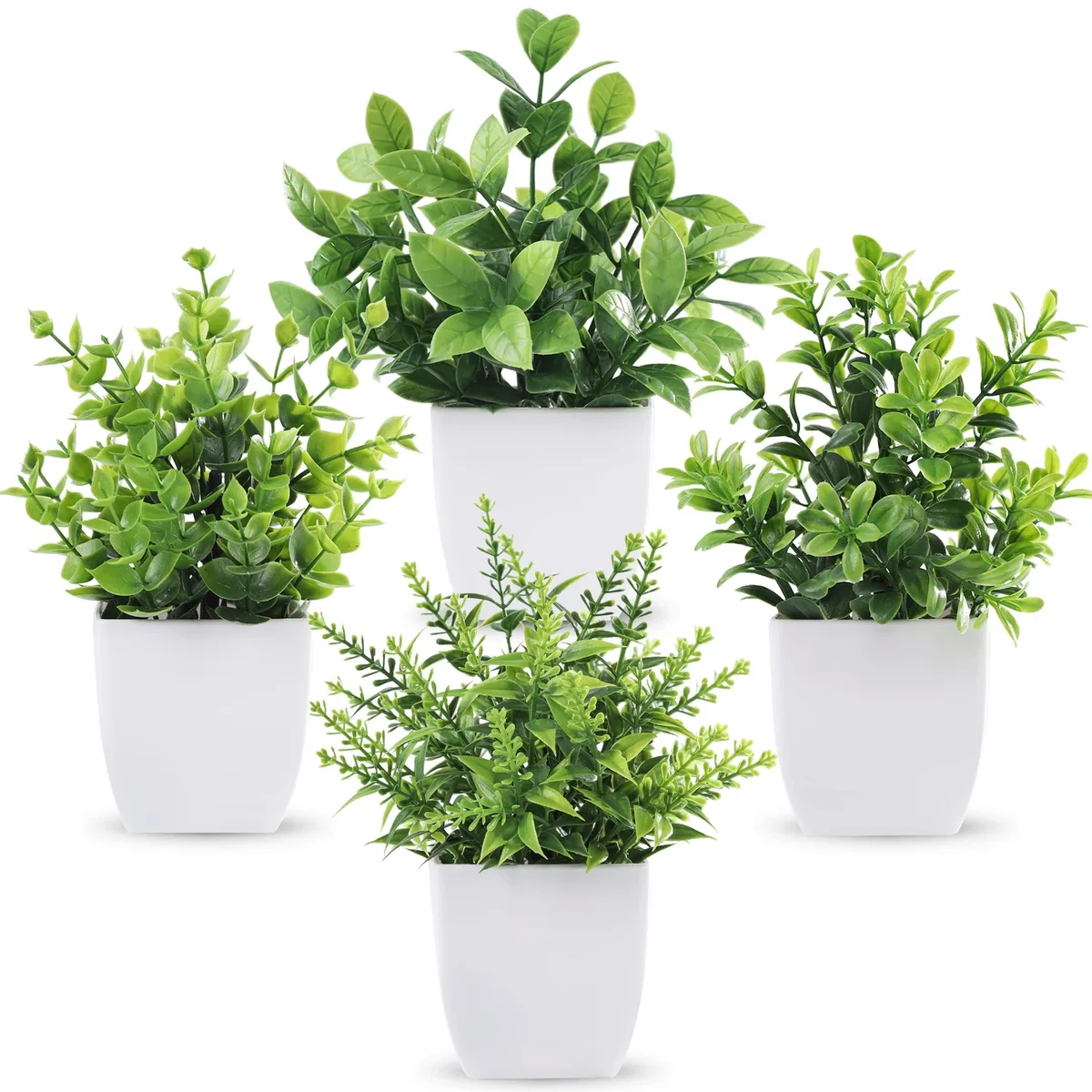 Four small white plastic pots each holding a green artificial plant