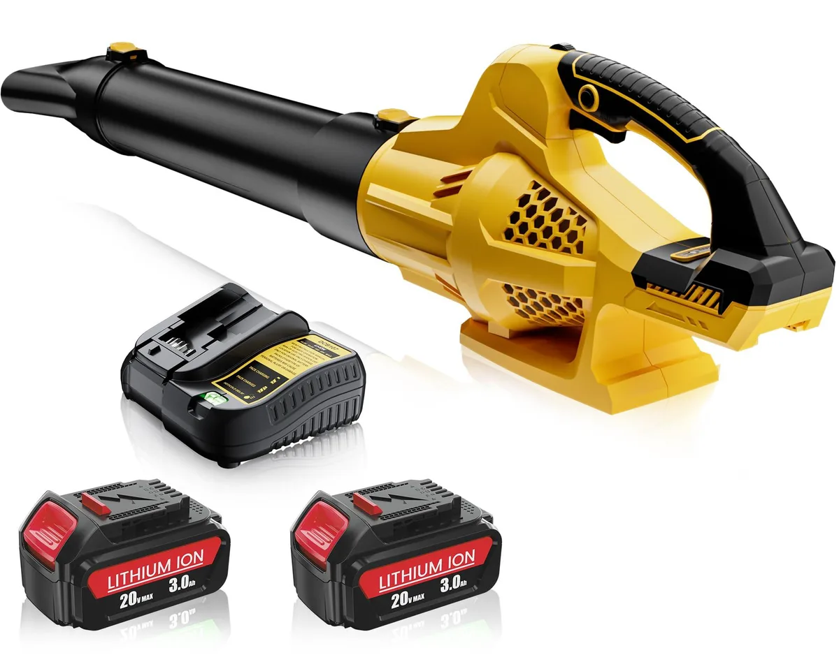 Orange cordless leaf blower with black tube, two batteries and charger, shown on grass