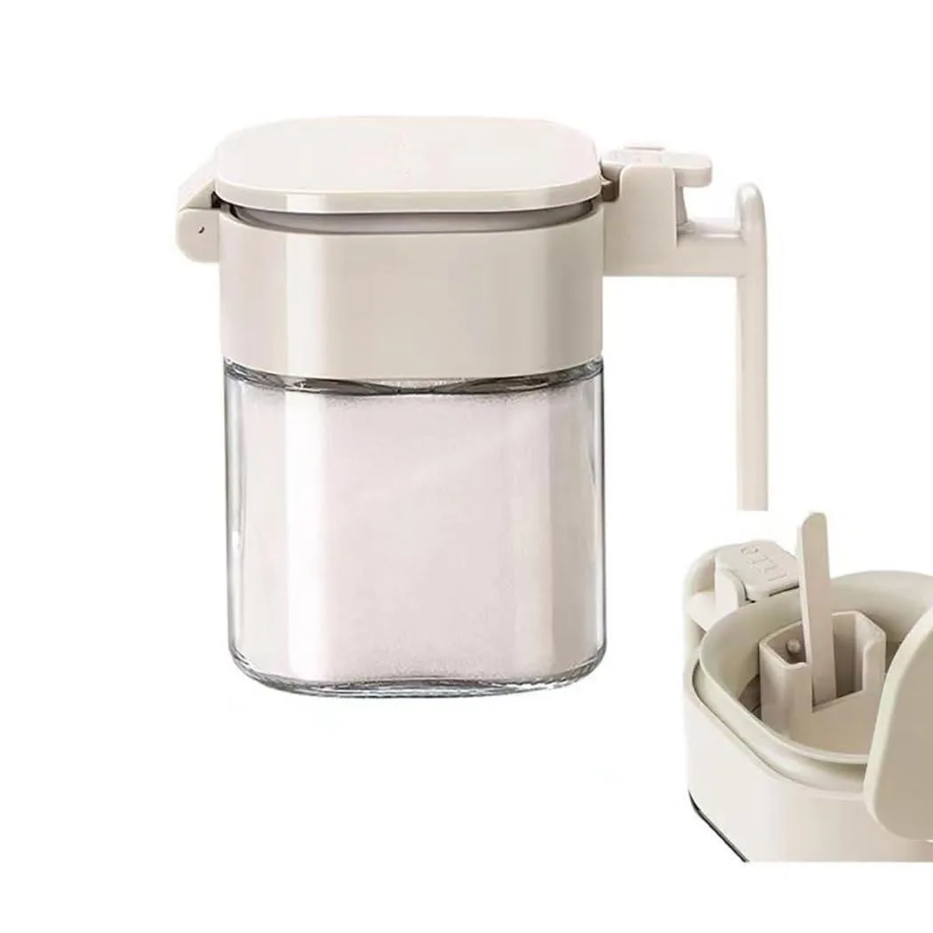 Red plastic two-tier spice jar with press-to-open lid and built-in spoon rest