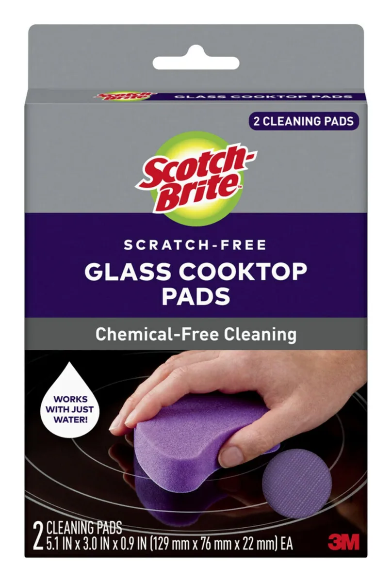 Two rectangular white cleaning pads with textured surfaces