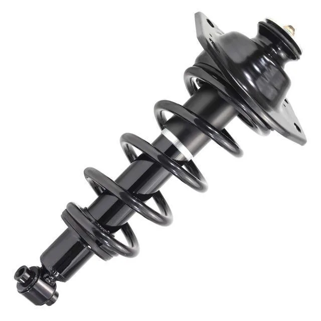 Silver metal rear right strut assembly with coiled spring and top mount on grey background