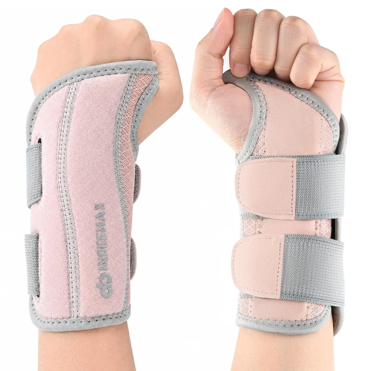 Pink right-hand wrist brace with mesh fabric and adjustable straps