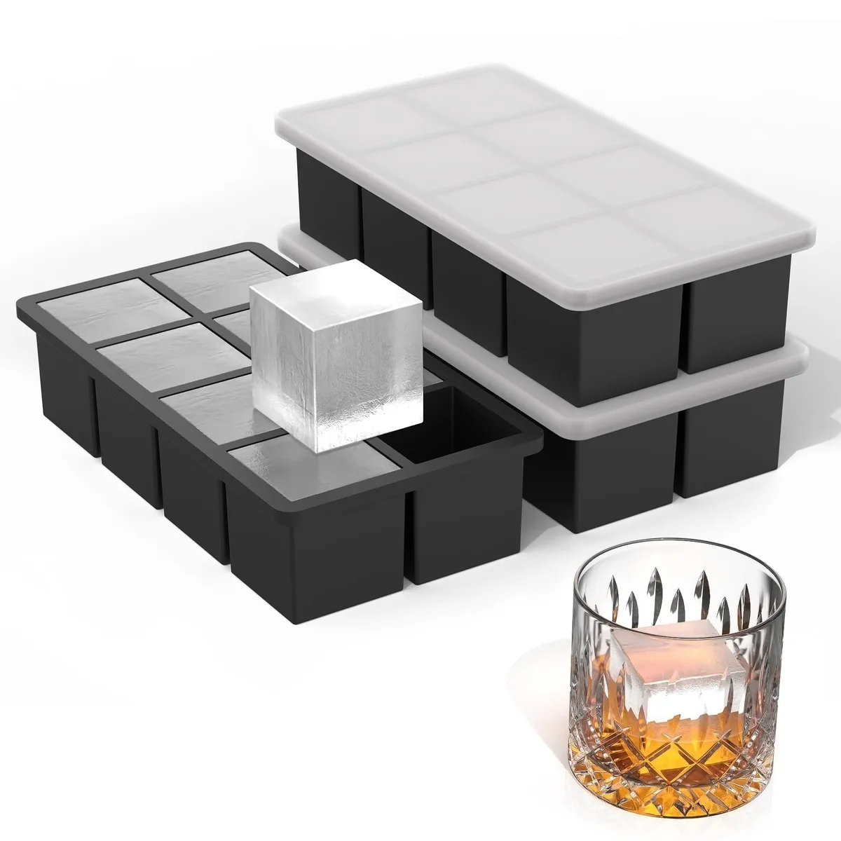 Three black silicone ice cube trays with metal frames and lids, rectangular, stackable