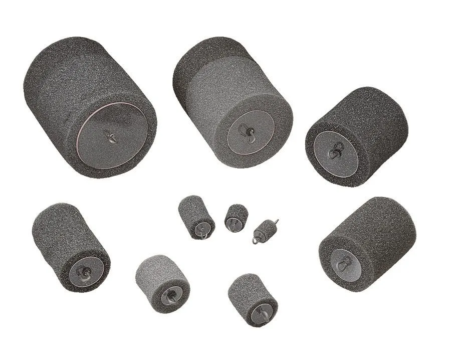 Five grey foam conduit pistons, 3.25 in long, 3.3 in wide