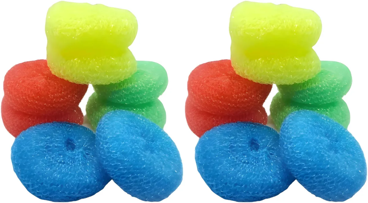 Sixteen small round nylon scouring pads in red blue yellow green on a surface