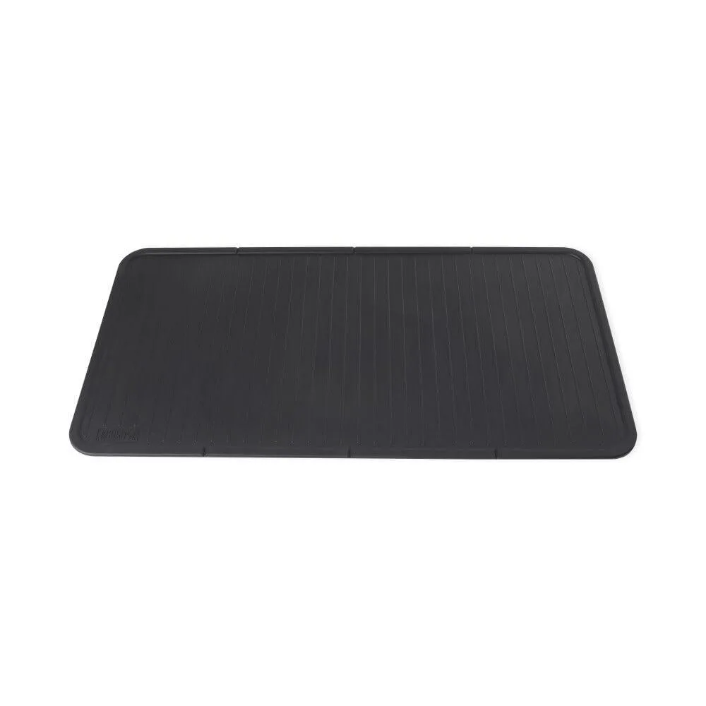 Black silicone mat rolled on a griddle middle shelf