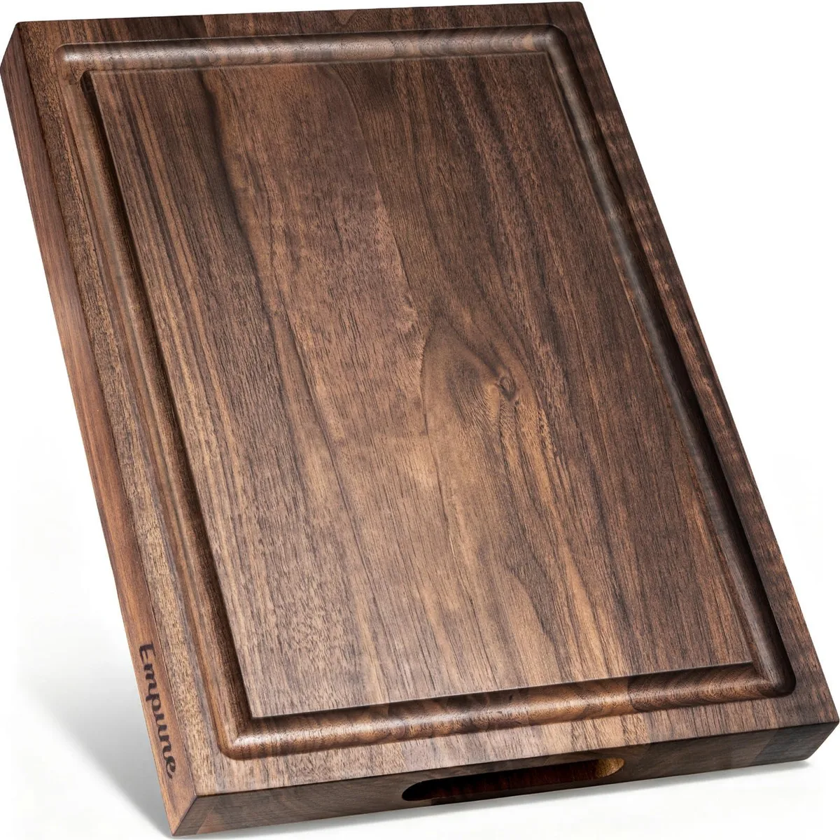 Rectangular black walnut cutting board with deep juice groove, side handles and silicone feet