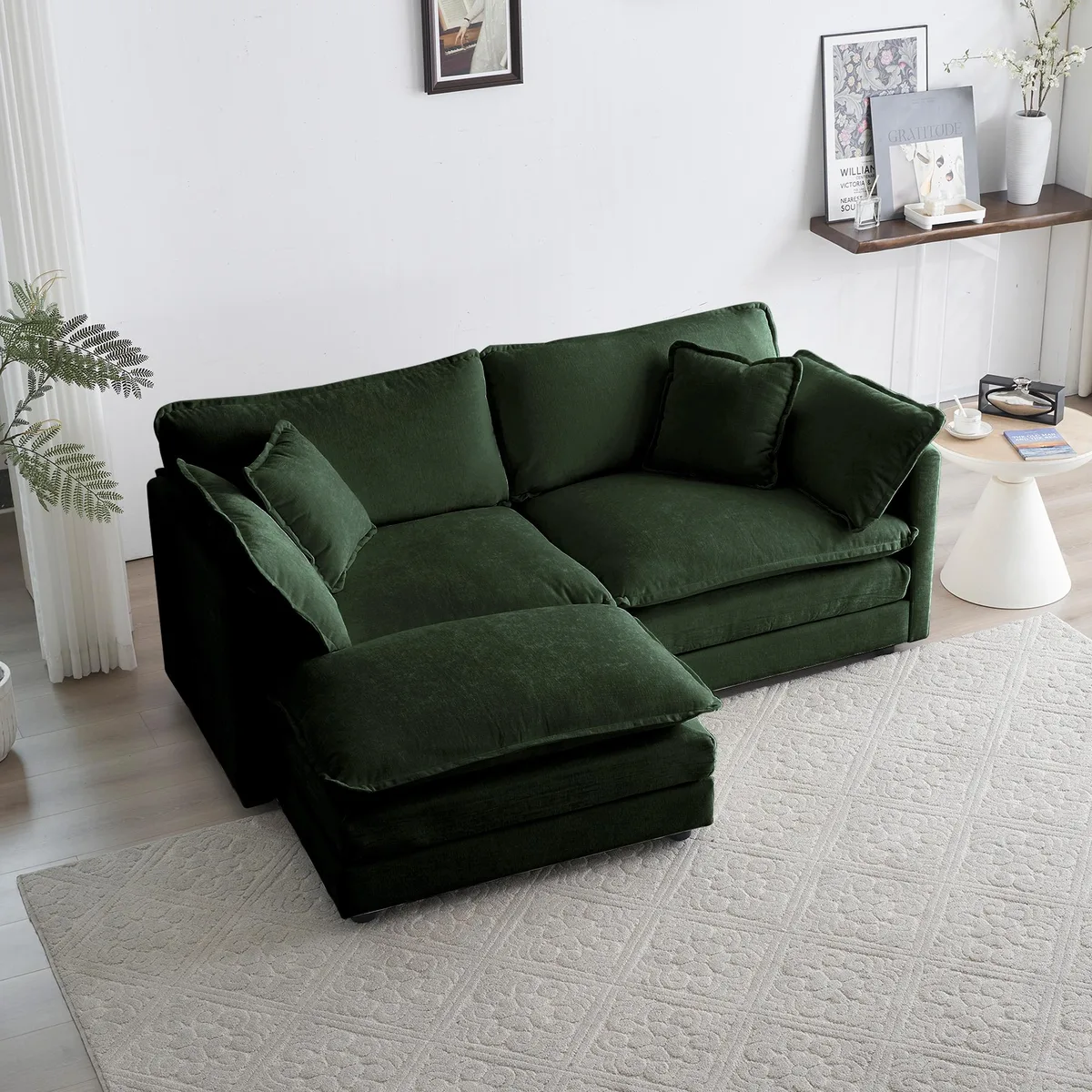 Green chenille L-shaped two-seater sectional with matching ottoman and scatter cushions