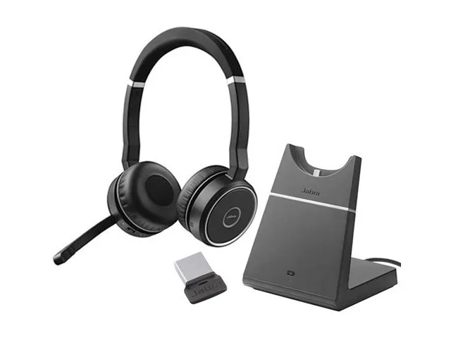 Black over-ear headset on a charging stand with leather-feel cushions and a flip-down boom microphone