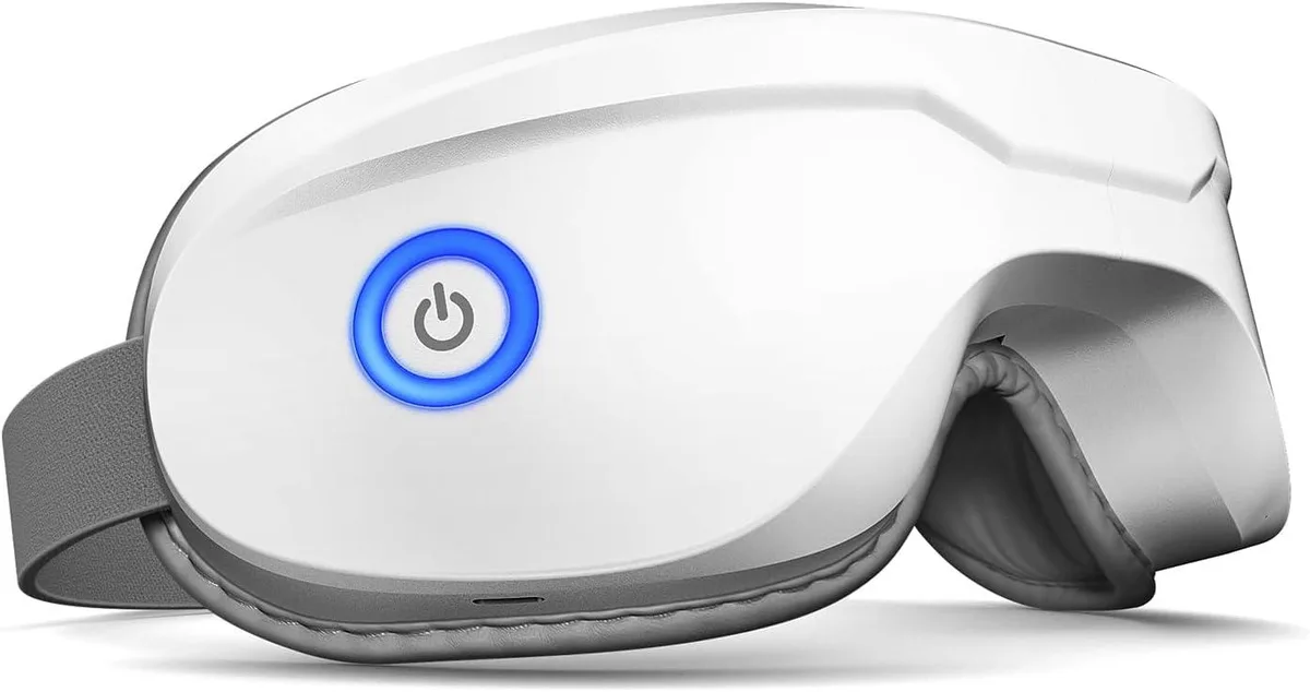 White foldable eye massager with adjustable headband, compact and curved shape