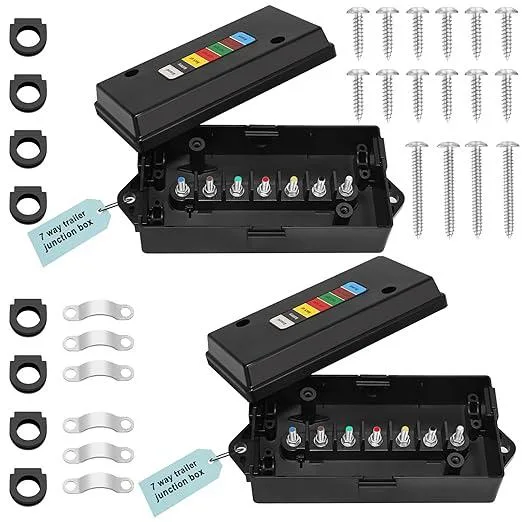 Two black rectangular trailer junction boxes with color-coded terminal studs and multiple wire entry points