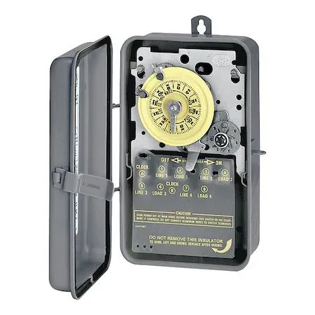 Grey metal enclosure with timer dial and trippers