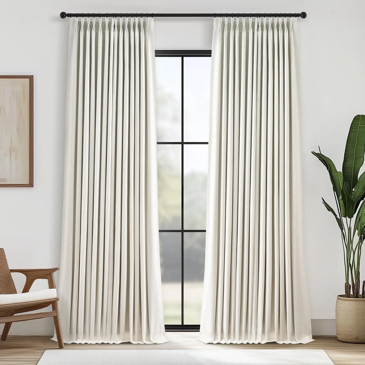 Two oatmeal linen blend blackout drapes 90 inches long with pinch pleats and metal rings