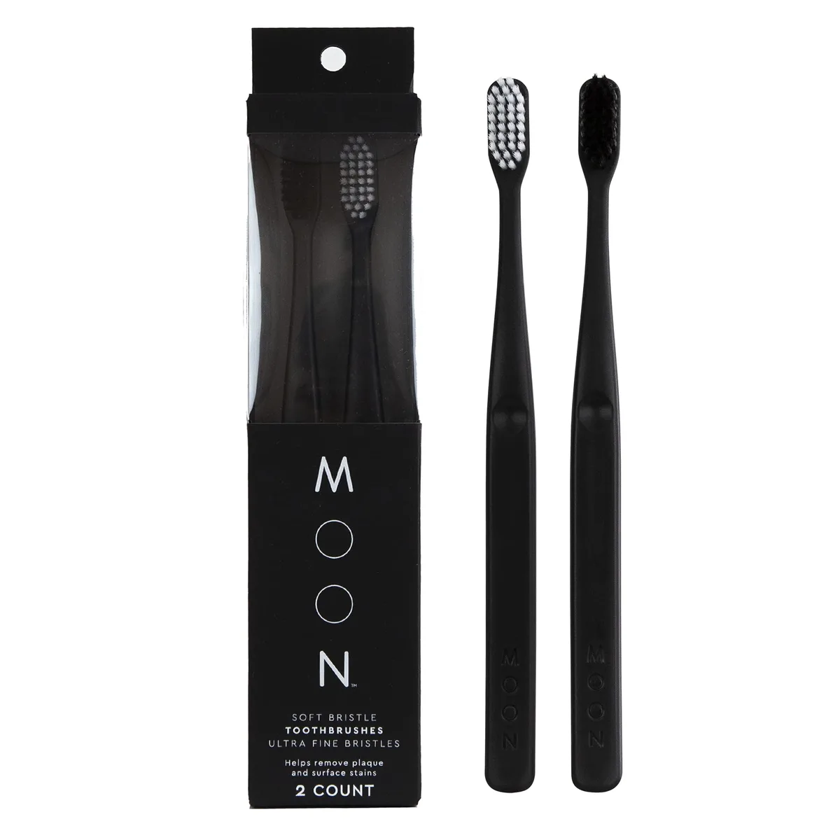 Two white manual toothbrushes with tapered bristles in a pack