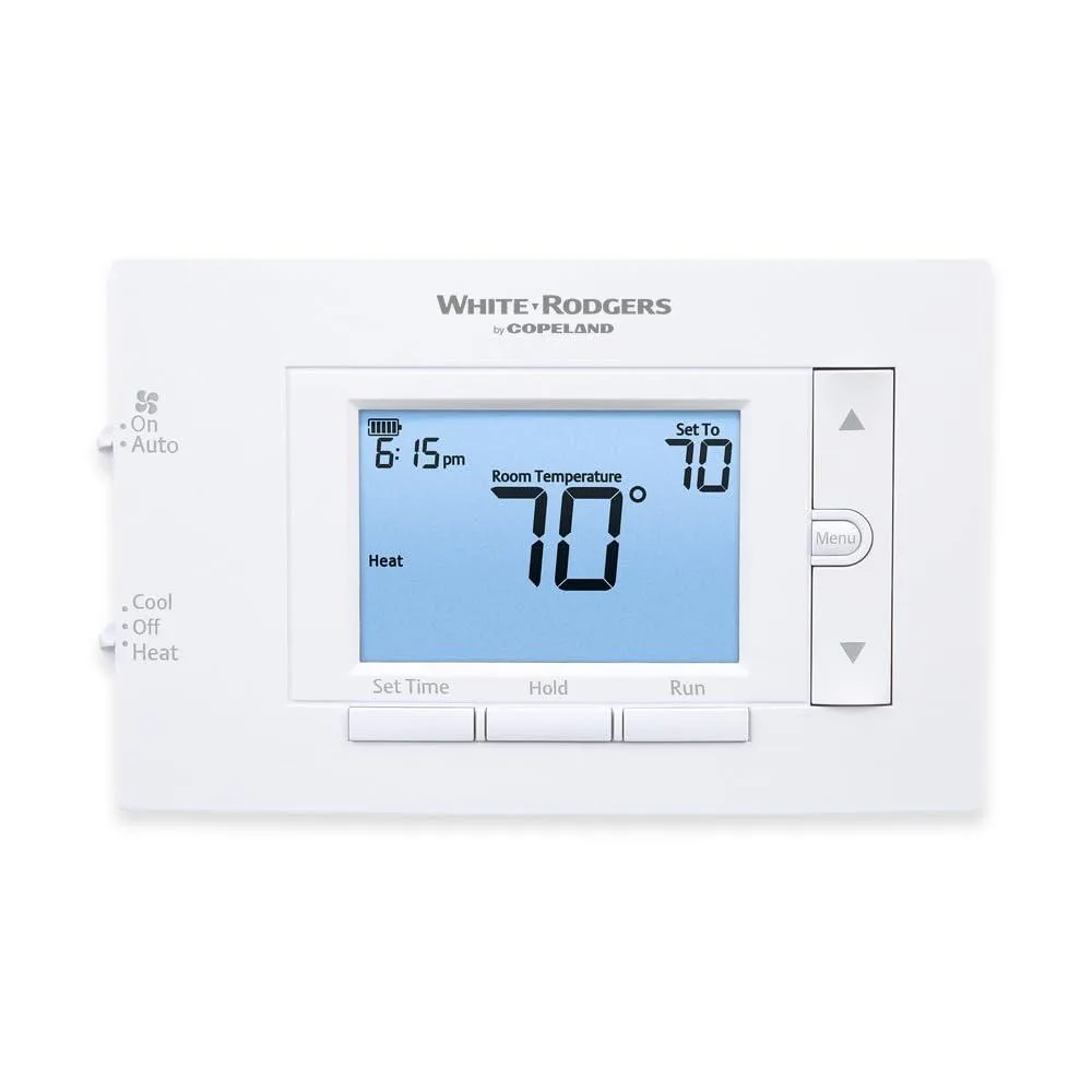 White rectangular wall thermostat with digital display and buttons