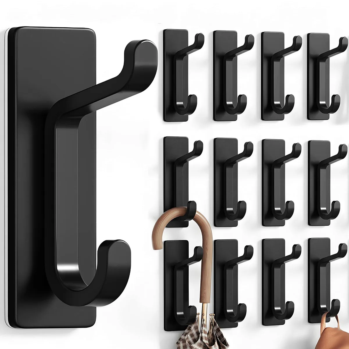 Twelve black double hooks with adhesive backing, twenty-four hook ends total