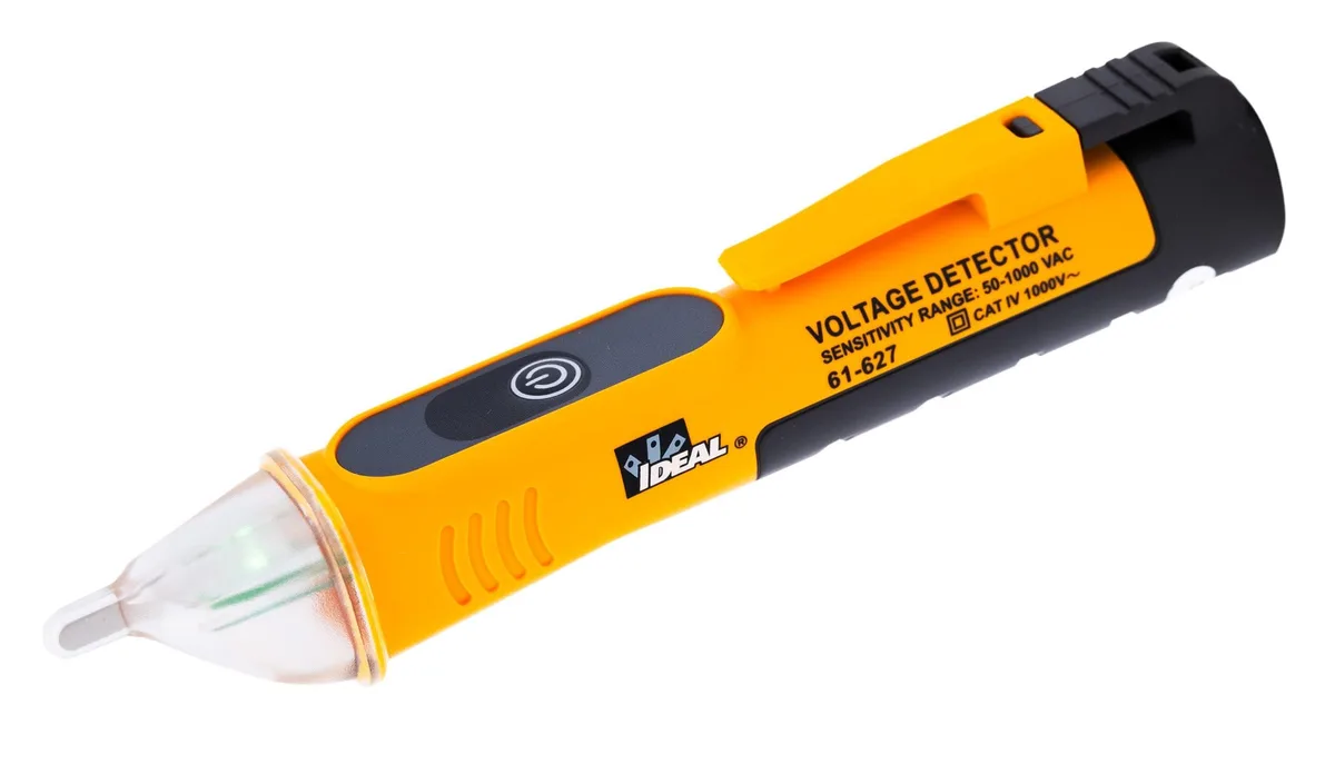 Compact green and red handheld voltage tester with pocket clip