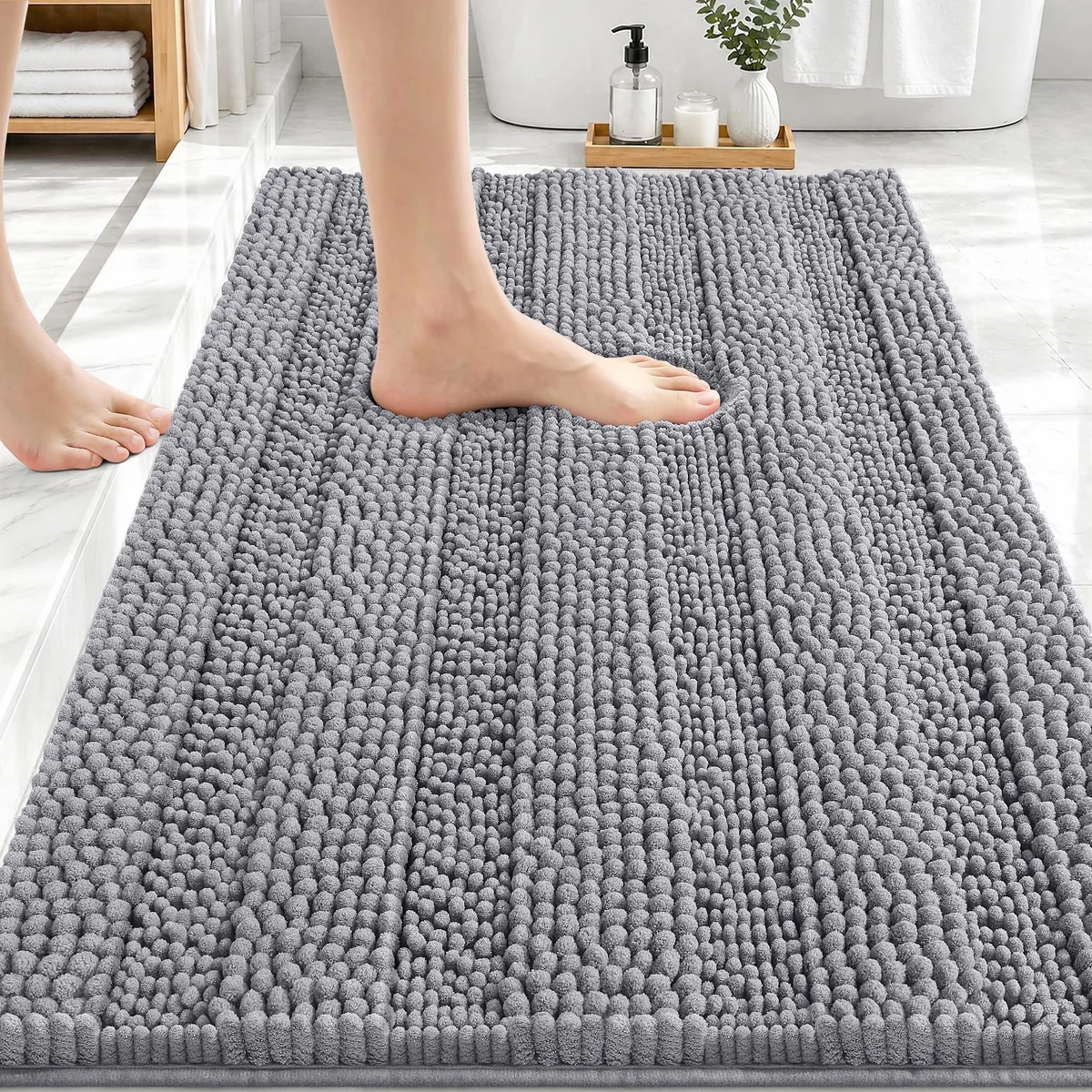 Rectangular grey chenille bath rug with striped texture and TPR backing