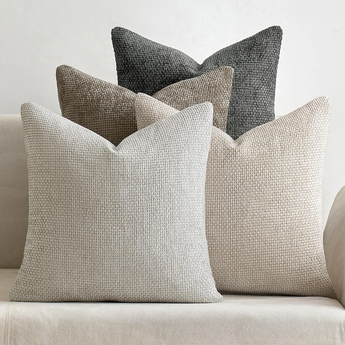 Four square chenille pillow covers in neutral tones, 18 by 18 inches, soft loop pile texture with hidden zipper edges