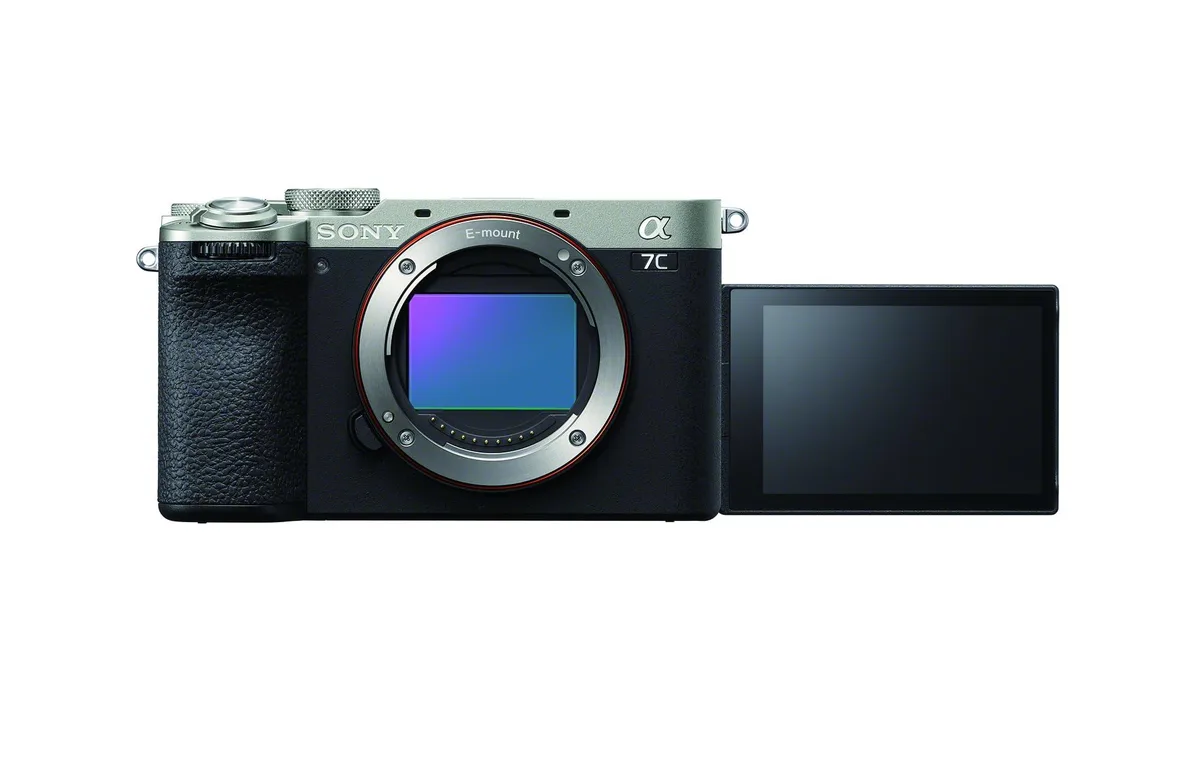 Silver compact mirrorless camera with vari-angle touchscreen and built-in viewfinder