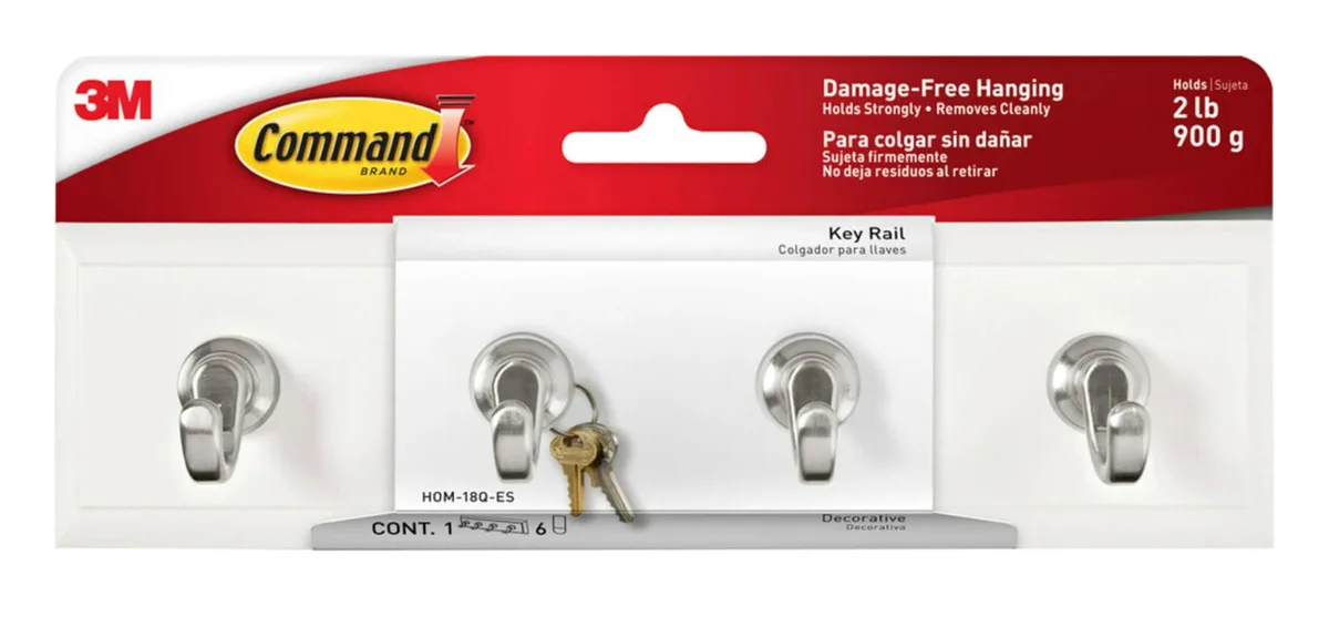 A translucent quartz key rail with six small adhesive strips