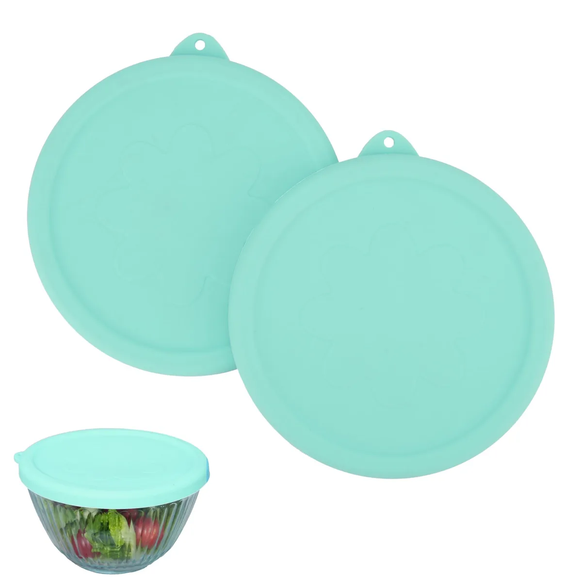 Two green flexible silicone lids with hanging holes, shown flat and curved, for Pyrex 7401-S bowls